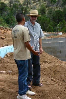 Steve Paxton speaking with member of construction crew...
